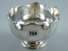 A circular silver pedestal bowl with Celtic style border, 10 ozs, London 1918