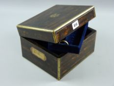 A Victorian coromandel and brass bound jewellery box with inset brass carry handles and inset