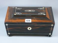 A Victorian coromandel and mother of pearl inlaid sarcophagus form jewellery casket on turned bun
