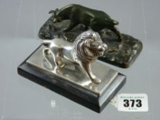 A silver plated model of Leo of Lion of MGM Pictures set on an ebonized stepped base with