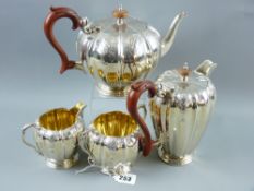 An attractive heavy four piece silver tea and coffee service, each piece of neat proportions with