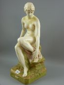 A Royal Dux large figurine of a seated nude classical maiden, 49 cms high (old repairs)