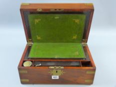 A Victorian mahogany and brass bound writing slope with inlaid fancy brass top cartouche and