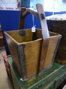 A Chinese Water Bucket, rectangular form tapering to the base, metal banding to the corners est 40