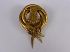 An Edwardian yellow gold tassel brooch with the original box, est. 5.8 gms.
