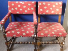 A set of six Edwardian oak dining chairs includes two carvers, the chairs having turned and ribbed