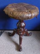 A Victorian Mahogany Adjustable Piano Stool, on cabriole legs.