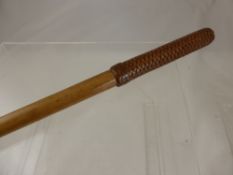 A weighted swagger stick.