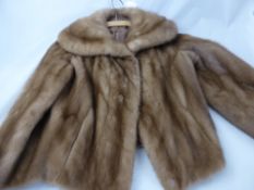 A Lady's Mink Short Cape, size medium.