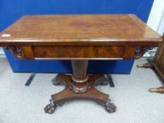 An Edwardian mahogany open leaf tea table, having a bulbous centre column and four ornately carved