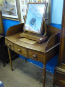 An Edwardian mahogany bow fronted washstand having three drawers on turned legs, approx. 95 x 53 x