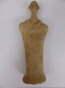 A Syro-Hittite Terracotta Figure, shows a face embellished with bird-like features with round
