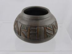A clay pot decorated with an 