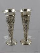 A Pair of Silver Posy Vases, embossed with flag iris and water reeds, London hallmark, pprox 16 cms,