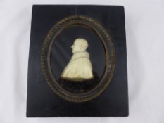 An 18th Signed Wax Carving of an Italian Priest. The robed figure signed L. Hagloll to base in