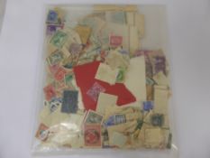 An Album of Pre-1952 Commonwealth Stamps, mostly used but with some attractive m/m sets.