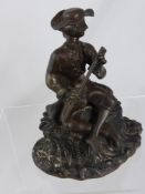 A Victorian cast iron 17th century style figure of a flute player sitting on a rock, est. 20 cms.