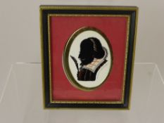 Three framed and glazed silhouettes depicting 