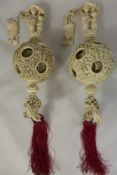 A Pair of Early 19th Century Cantonese Ivory Puzzle Balls, each ball carved from a single piece of