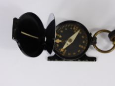 A German Military WWII Compass & Strap, stamped NEAG (Norddeutsche Elektro Akustik Gesellschaft)