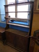 A Victorian Oak Dresser having three open shelves to the top and two cupboards under, approx. 121