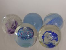 Five Caithness Glass Paper Weights, including 'Cup Cake', 'Sparkle', 'Harmonic' white, blue and
