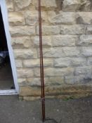 An Antique Hard Wood Mahogany 2 pce Fly Fishing Rod approx 4 mts.