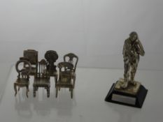 A Silver Plated Figure of a RAF Fight Pilot circa 1949 approx 15 cms h and a tin of metal animals