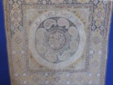 A Middle Eastern Embroidery, highlighted with silvered thread, Arabic character marks to the central