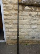 A Grand Slam Two Piece Fishing Rod together with spinning reel.