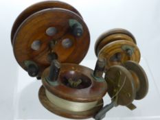 Four Vintage Wooden Fishing Reels, including an Eton Sun and three others unmarked.