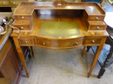 A Reproduction Maple and Mahogany Escritoire, the desk having a bow front with four drawers to top