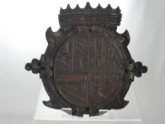 A Wooden Antique Armorial depicting carved Coat of Arms with a crown atop, inscribed on reverse 