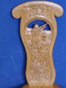 A Sid Pollard Oak Chair, the back carved with a central cameo depicting a shooting scene with floral
