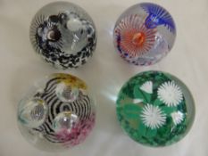 Four Caithness Glass Paper Weights, including  