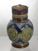 A Doulton Lambeth Stoneware Jug, commemorating the reign of Queen Victoria 1837-1897. The jug