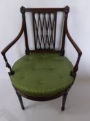 Two Chairs with Green Upholstery, the first an armchair with studded cushion on circular seat and