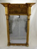 A Gilt Finish Wall Mounted Mirror, Corinthian style columns to either side with lattice decoration