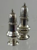 Two Antique Solid Silver Georgian Peppers, London hallmark, the first dated 1820 m.m R J (damage