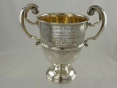 A Irish Silver Double Handled Presentation Cup, engraved 