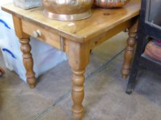 A Pine Table with turned legs and drawer to one side, approx 74 x 91 x 77 cms.