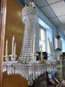An Elegant Antique Gilded Brass Eight Branch Crystal Chandelier, wire conversion.