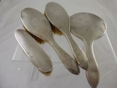 A Solid Silver Dressing Table Set, including hand mirror, two hair brushes, clothes brush,