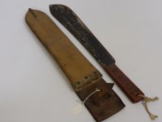 A Malayan Panga dated 1952, sheath dated 1954, military marks.