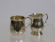 A Silver Creamer London hallmark dd 1936, mm RC, approx 78 gms together with a Christening cup