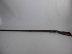 An Antique North African Flint Lock Musket, with Continental influence, checkered wrist and scroll