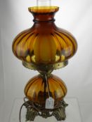 A Victorian Amber Glass Oil Lamp, wired for conversion.