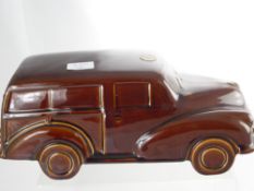 A Dartmouth Pottery England brown porcelain miniature Morris Minor motor car approx  39 x 17 cms.