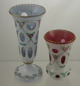 Two Bohemian Cased Glass Vases, white over blue and a white over cranberry, hand painted with rose