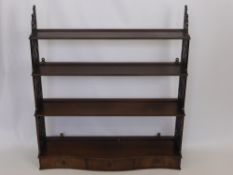 A Chippendale Style Waterfall Book Case. The book case having fret work to sides with three